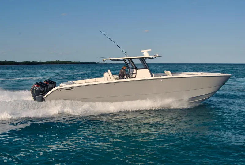 Slide: The Image of 2020 Invincible 40 Catamaran cruising on open water. - 11