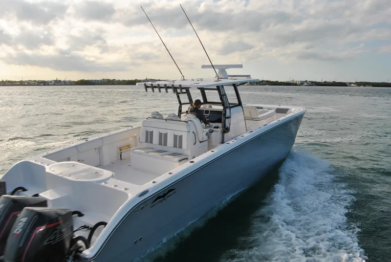 Slide: The Image of 2020 Invincible 40 Catamaran cruising on open water. - 13