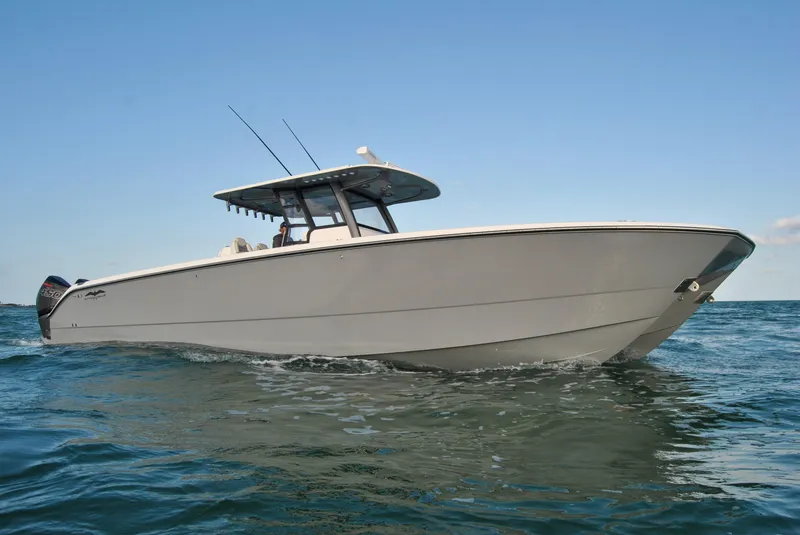 Slide: The Image of 2020 Invincible 40 Catamaran cruising on open water. - 14