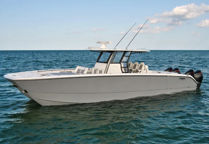 Slide: The Image of 2020 Invincible 40 Catamaran on open water with clear sky. - 2