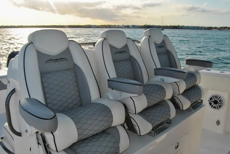 Slide: The Image of Luxurious seating on 2020 Invincible 40 Catamaran, ocean backdrop. - 28