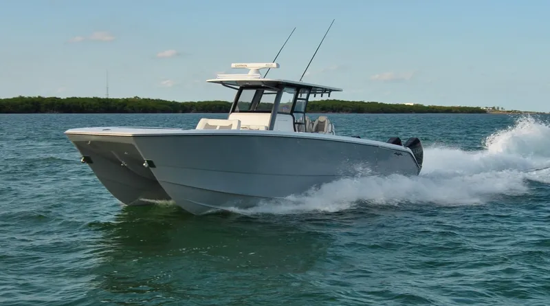 Slide: The Image of 2020 Invincible 40 Catamaran cruising on open water. - 4