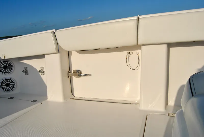 Slide: The Image of Interior view of 2020 Invincible 40 Catamaran with white seating and storage compartment. - 40