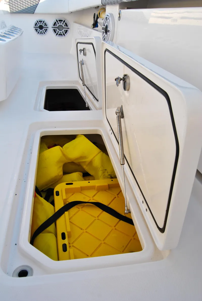 Slide: The Image of Storage compartments on a 2020 Invincible 40 Catamaran with yellow gear inside. - 43