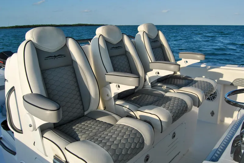 Slide: The Image of Luxurious seating on 2020 Invincible 40 Catamaran with ocean backdrop. - 49