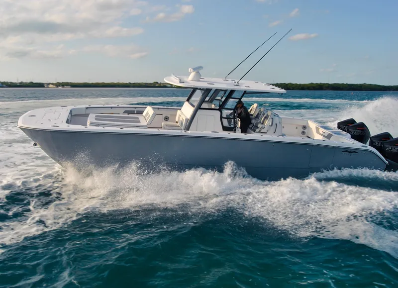 Slide: The Image of 2020 Invincible 40 Catamaran cruising on open water. - 9