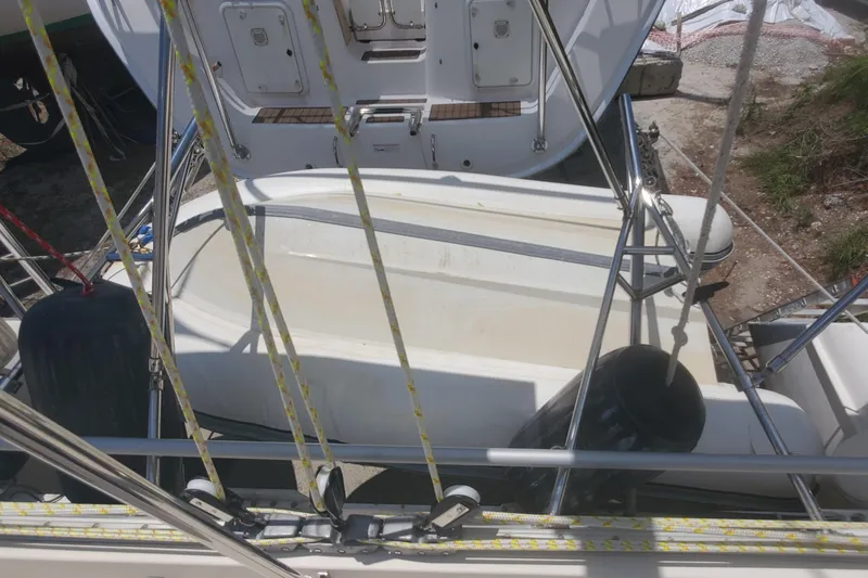 Slide: The Image of 1992 Fountaine Pajot Antigua 37 catamaran deck with rigging and storage compartments. - 11