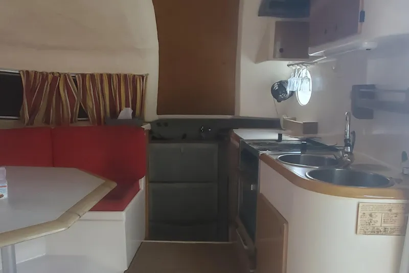 Slide: The Image of Interior of 1992 Fountaine Pajot Antigua 37 catamaran with kitchen and dining area. - 29