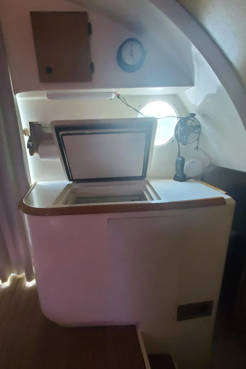 Slide: The Image of Interior of 1992 Fountaine Pajot Antigua 37 yacht with open storage compartment. - 31