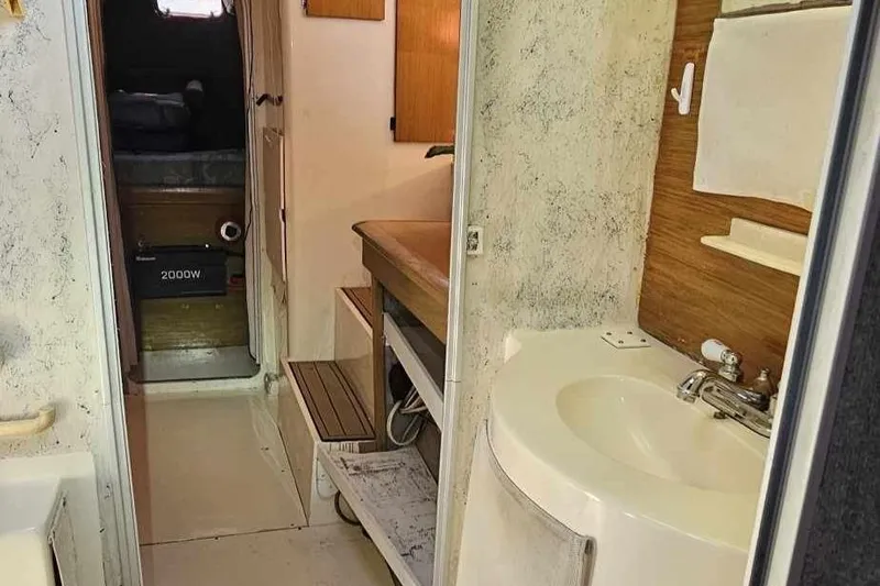 Slide: The Image of Interior of 1992 Fountaine Pajot Antigua 37 catamaran with sink and cabin view. - 40