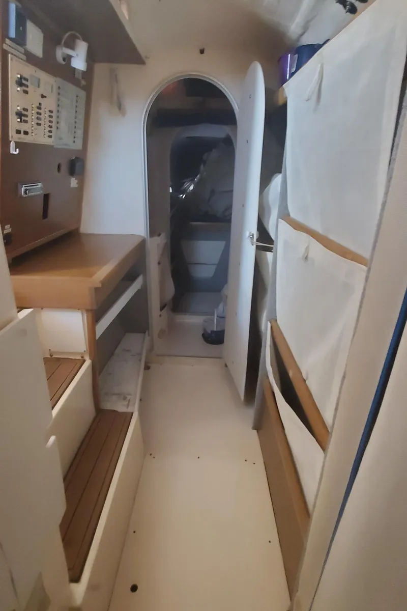 Slide: The Image of Interior of 1992 Fountaine Pajot Antigua 37 catamaran with wooden cabinetry and white walls. - 41