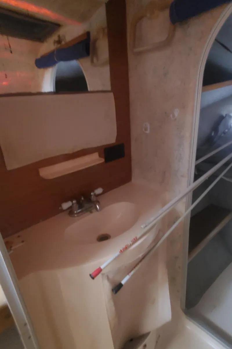 Slide: The Image of Bathroom sink area in a 1992 Fountaine Pajot Antigua 37 catamaran. - 43