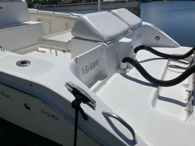 Slide: The Image of 2014 Marlago 35 boat stern with seating and docked at marina. - 16