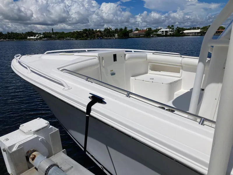 Slide: The Image of 2014 Marlago 35 boat docked on a sunny day with scenic water view. - 24