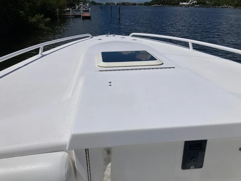 Slide: The Image of 2014 Marlago 35 boat bow view on a calm waterway. - 38
