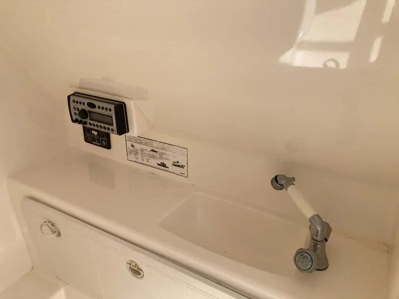 Slide: The Image of Control panel and sink area on a 2014 Marlago 35 boat. - 41