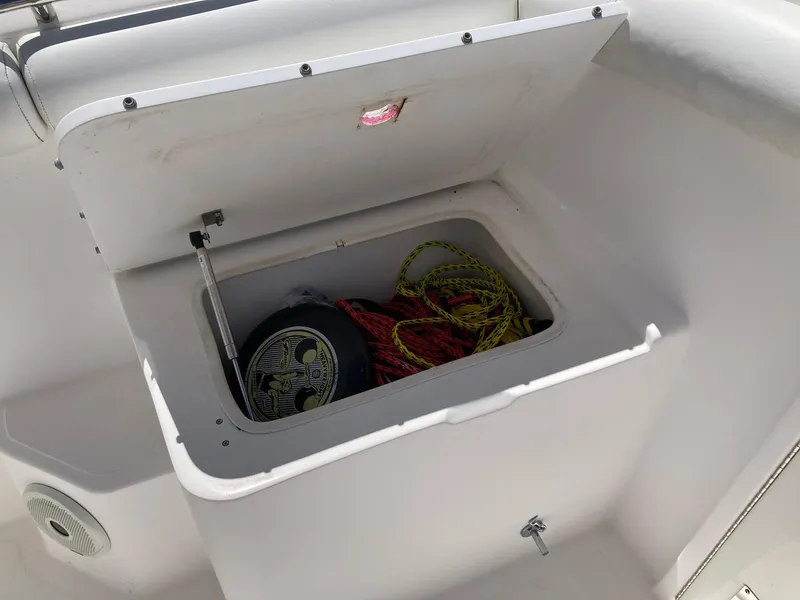 Slide: The Image of Open storage compartment on a 2014 Marlago 35 boat with ropes and equipment. - 44