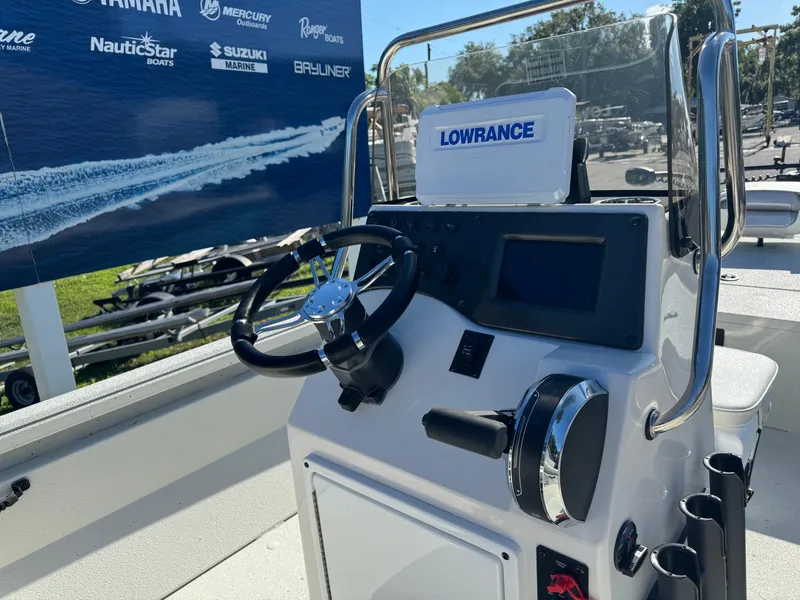 Slide: The Image of 2024 Ranger RB210 boat console with Lowrance electronics and steering wheel. - 5