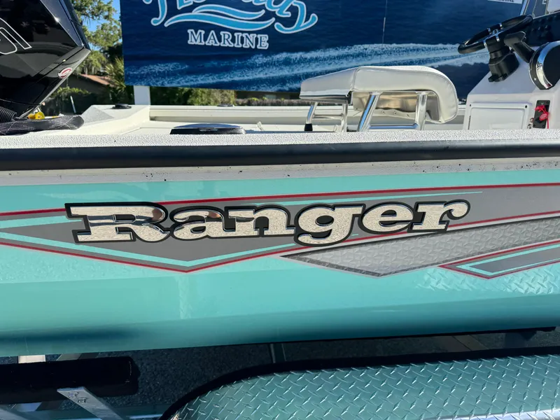 Slide: The Image of 2024 Ranger RB210 boat side view with logo and marine background. - 9