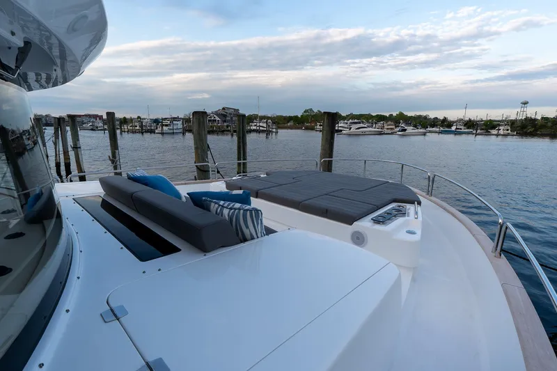 Slide: The Image of 2024 Sirena 58 Flybridge yacht with spacious deck and waterfront view. - 14