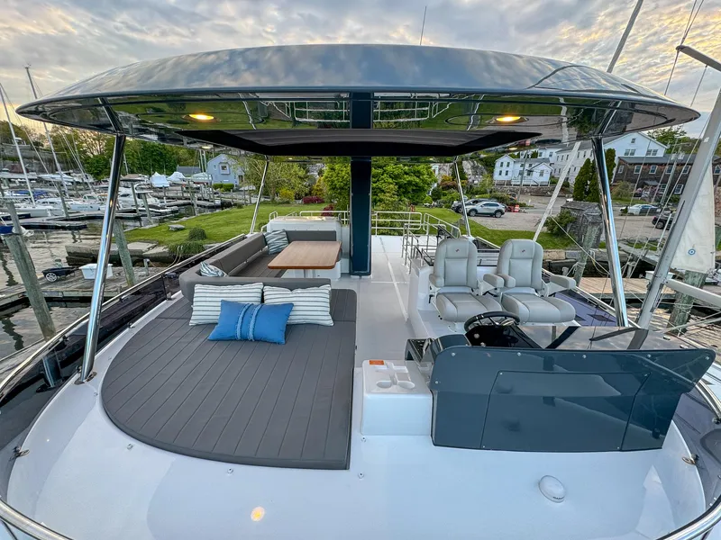 Slide: The Image of 2024 Sirena 58 Flybridge yacht with spacious deck and luxurious seating. - 34