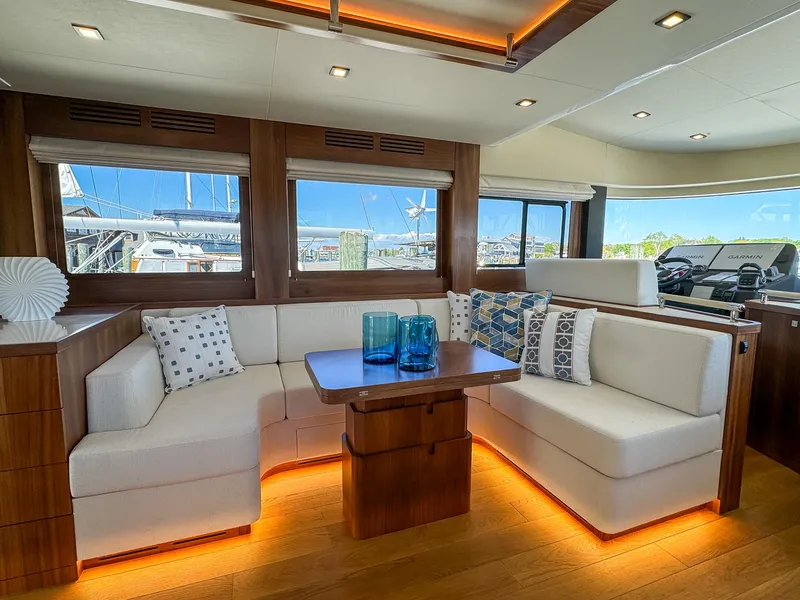 Slide: The Image of Luxurious interior of 2024 Sirena 58 Flybridge yacht with elegant seating and ambient lighting. - 46