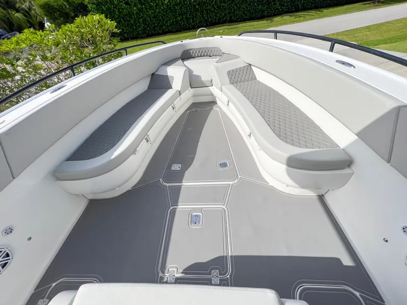 Slide: The Image of 2014 Midnight Express 37 Open boat interior with cushioned seating and spacious deck. - 16
