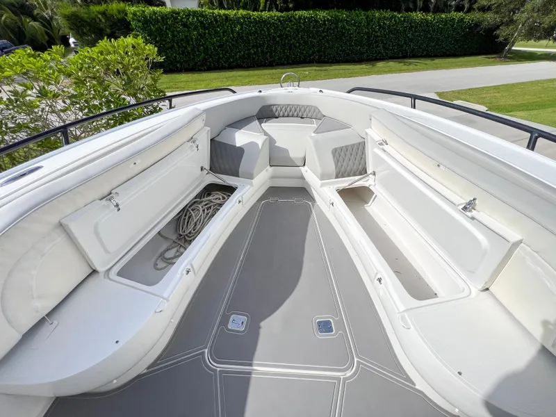 Slide: The Image of 2014 Midnight Express 37 Open boat interior with storage compartments and seating. - 17