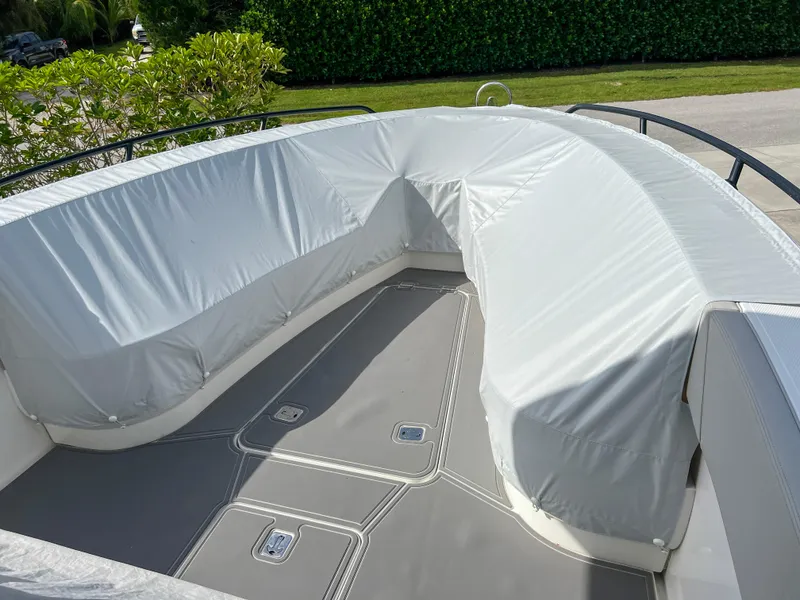 Slide: The Image of 2014 Midnight Express 37 Open boat with covered seating area. - 18