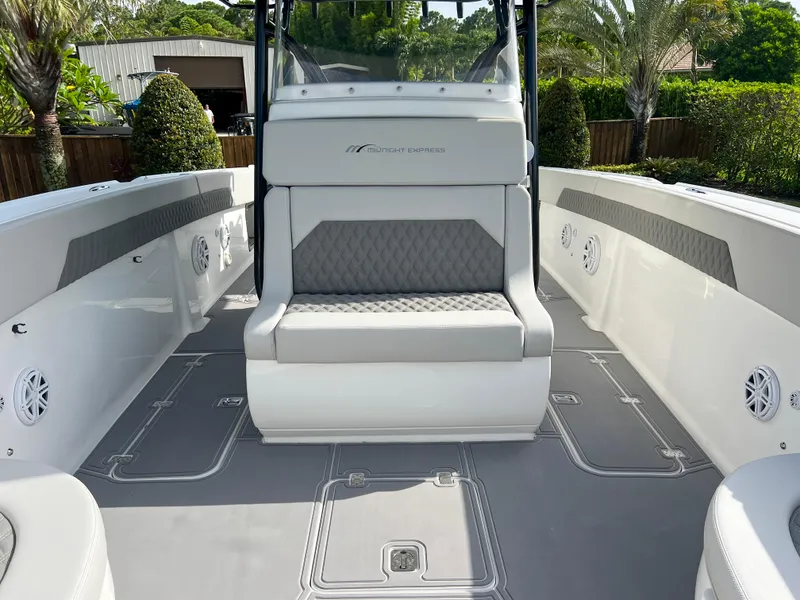 Slide: The Image of 2014 Midnight Express 37 Open boat interior with seating and clean deck. - 22