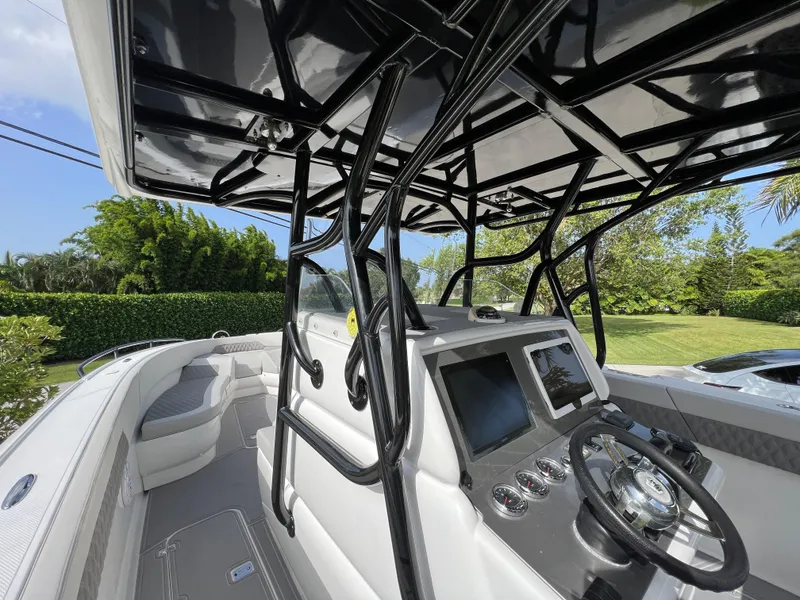 Slide: The Image of 2014 Midnight Express 37 Open boat interior with modern dashboard and seating. - 27