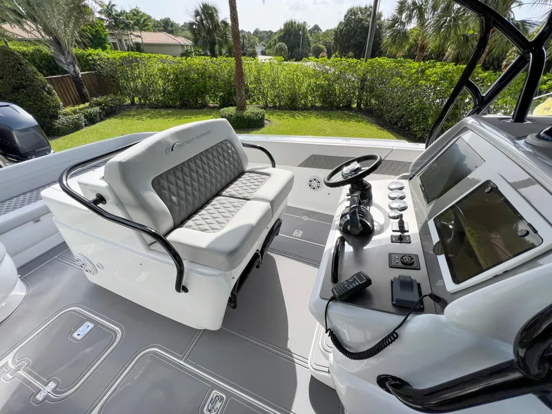 Slide: The Image of 2014 Midnight Express 37 Open boat cockpit with helm and seating. - 30
