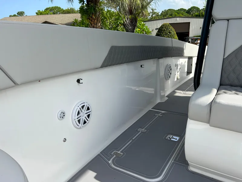 Slide: The Image of 2014 Midnight Express 37 Open boat interior with speakers and cushioned seating. - 33