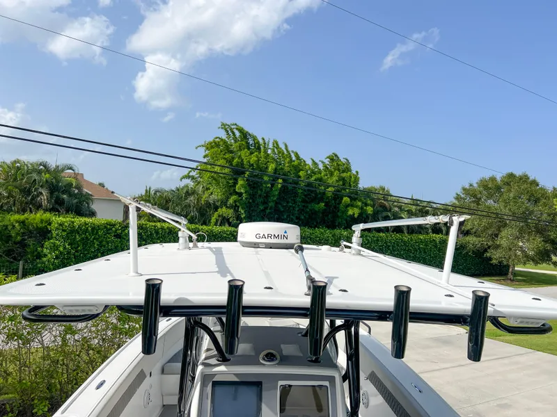 Slide: The Image of 2014 Midnight Express 37 Open boat with Garmin equipment, docked outdoors. - 36