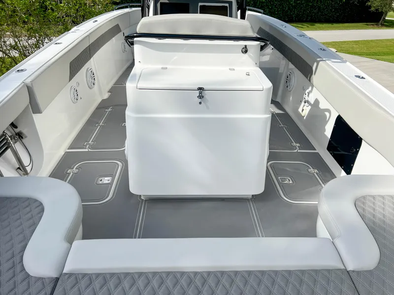 Slide: The Image of 2014 Midnight Express 37 Open boat interior with seating and storage. - 38