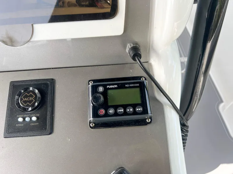 Slide: The Image of Control panel of a 2014 Midnight Express 37 Open boat. - 41