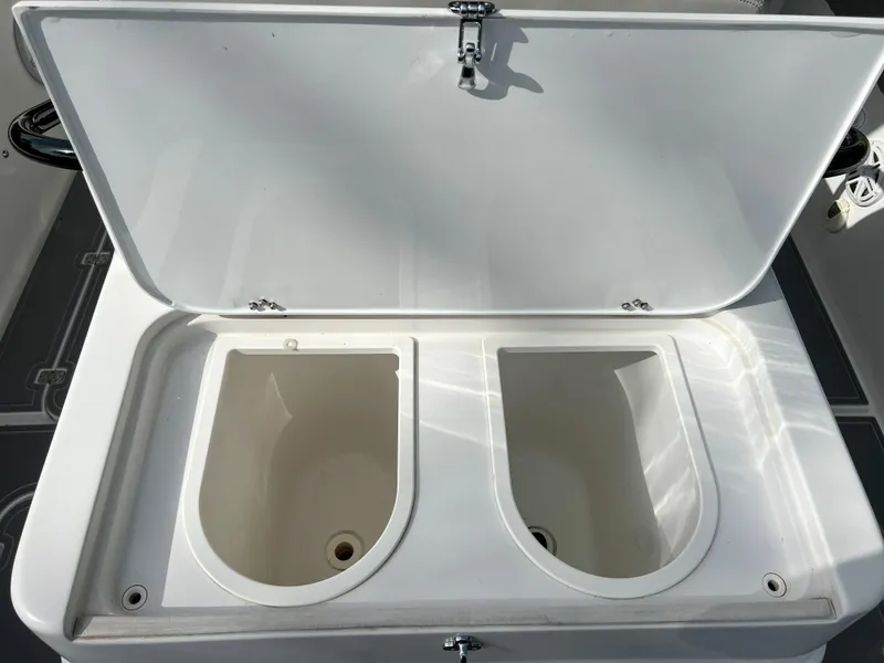Slide: The Image of Midnight Express 37 Open 2014 boat storage compartments with open lid. - 46