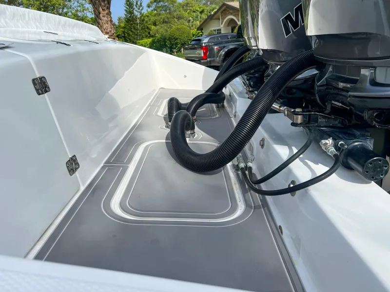 Slide: The Image of 2014 Midnight Express 37 Open boat deck with engine cables. - 47