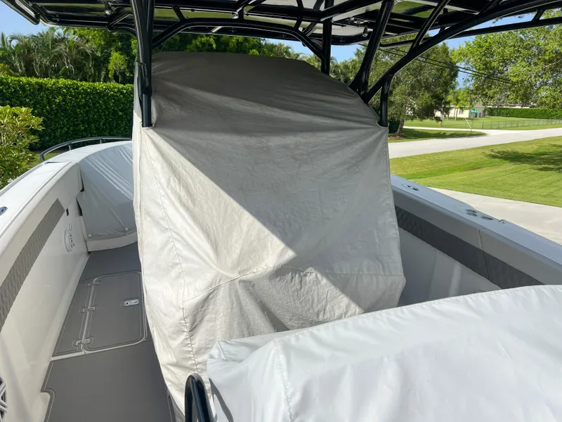 Slide: The Image of 2014 Midnight Express 37 Open boat with covered seating and console. - 48