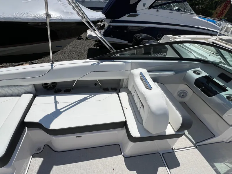 Slide: The Image of 2022 Regal LX2 boat interior with white seating and modern design. - 11