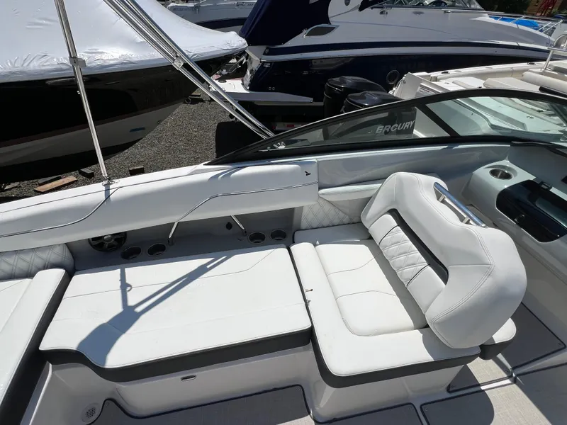 Slide: The Image of 2022 Regal LX2 boat interior with white leather seating and modern design. - 12