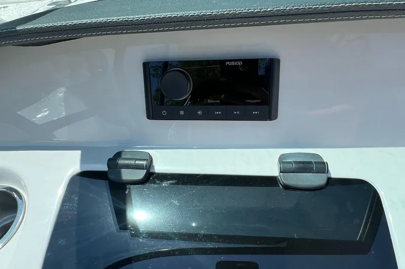 Slide: The Image of 2022 Regal LX2 boat dashboard with Fusion stereo system. - 13