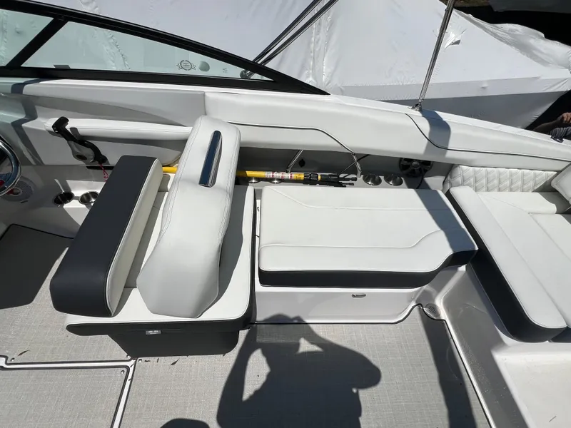Slide: The Image of 2022 Regal LX2 boat interior with white seating and modern design. - 14