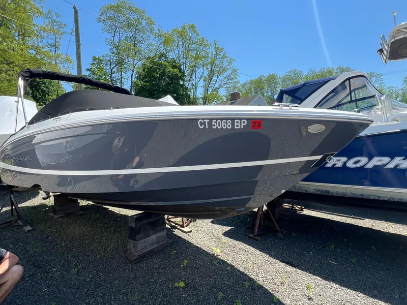 Slide: The Image of 2022 Regal LX2 boat on stands, side view, registration number CT 5068 BP. - 2