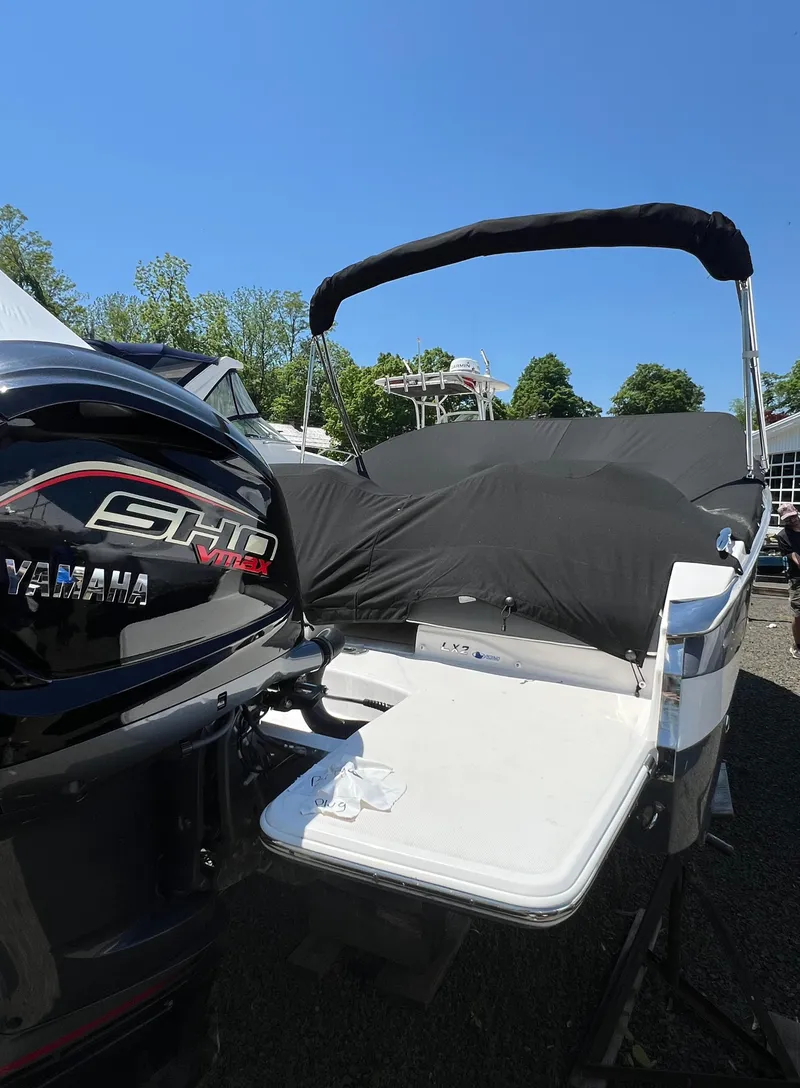 Slide: The Image of 2022 Regal LX2 boat with Yamaha SHO engine, covered and docked. - 4