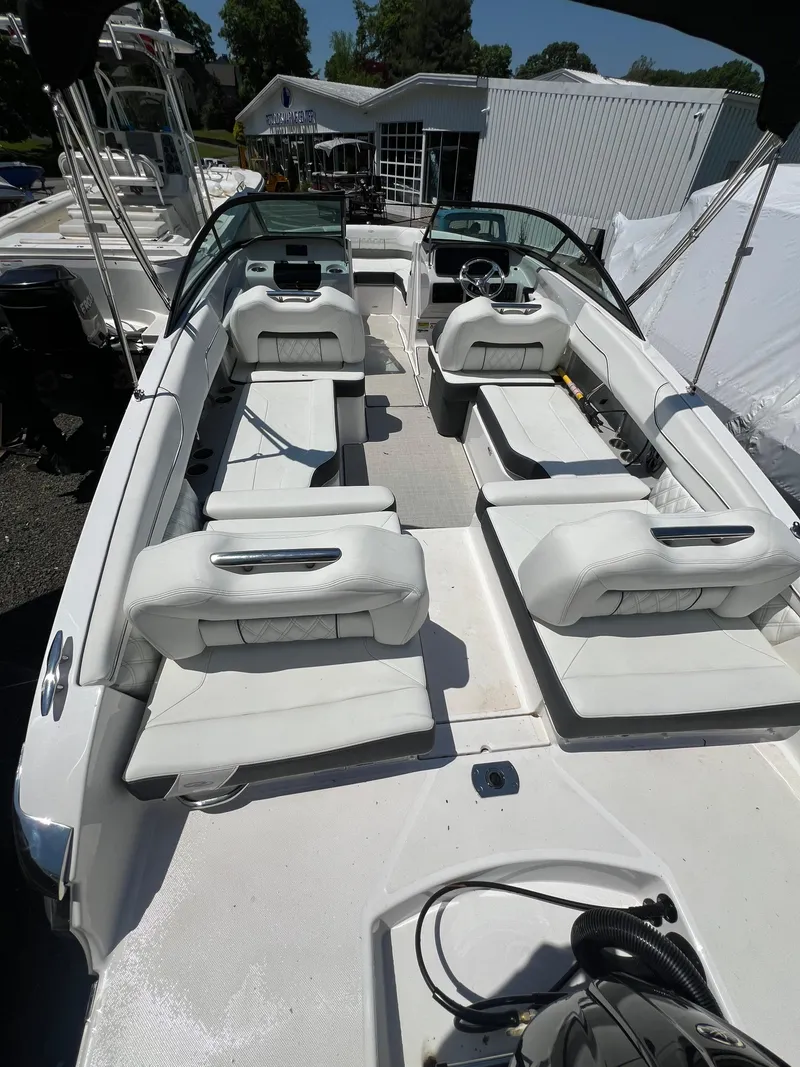 Slide: The Image of 2022 Regal LX2 boat with white interior and spacious seating. - 6