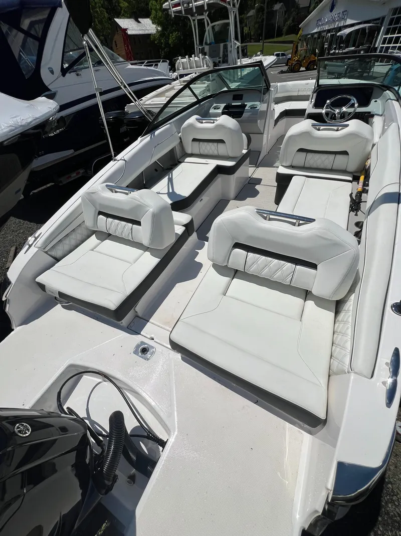 Slide: The Image of 2022 Regal LX2 boat with luxurious white seating and modern design. - 7