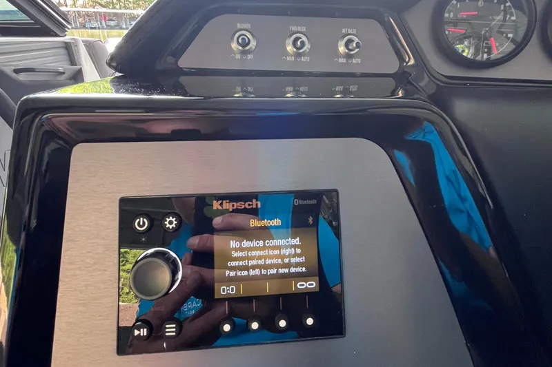 Slide: The Image of Control panel of a 2022 MasterCraft NXT22 boat with Klipsch Bluetooth display. - 49