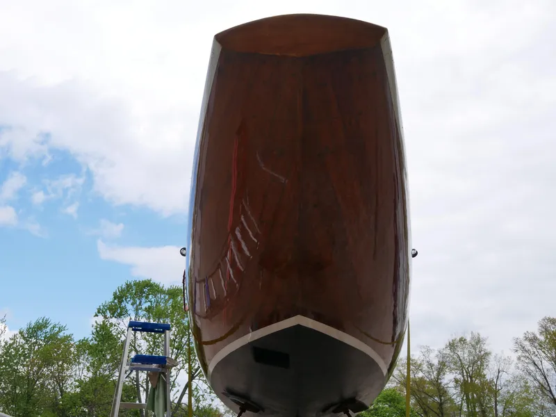 Slide: The Image of 1935 Custom 44' 30-Square Meter Sailing Yacht hull, polished and elevated, with a clear sky background. - 16