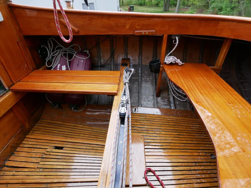Slide: The Image of 1935 Custom 44' 30-Square Meter Sailing Yacht interior with wooden benches and deck. - 22